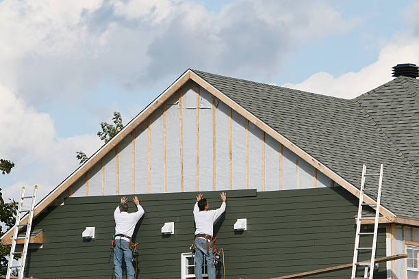 Professional Storm Damage Siding Repair technician working in Blaine, MN